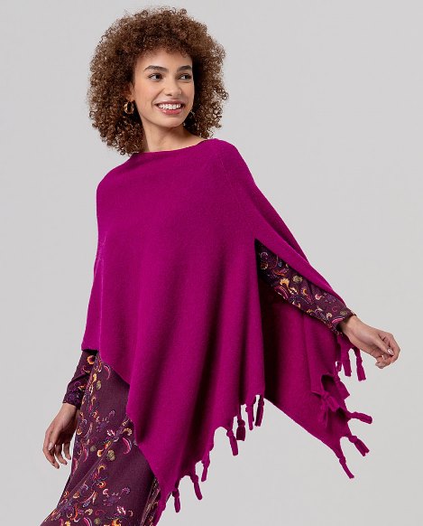 Poncho punto flecos fucsia